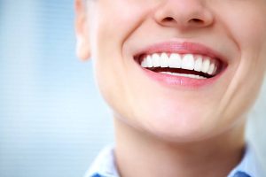 a person smiling with a healthy teeth